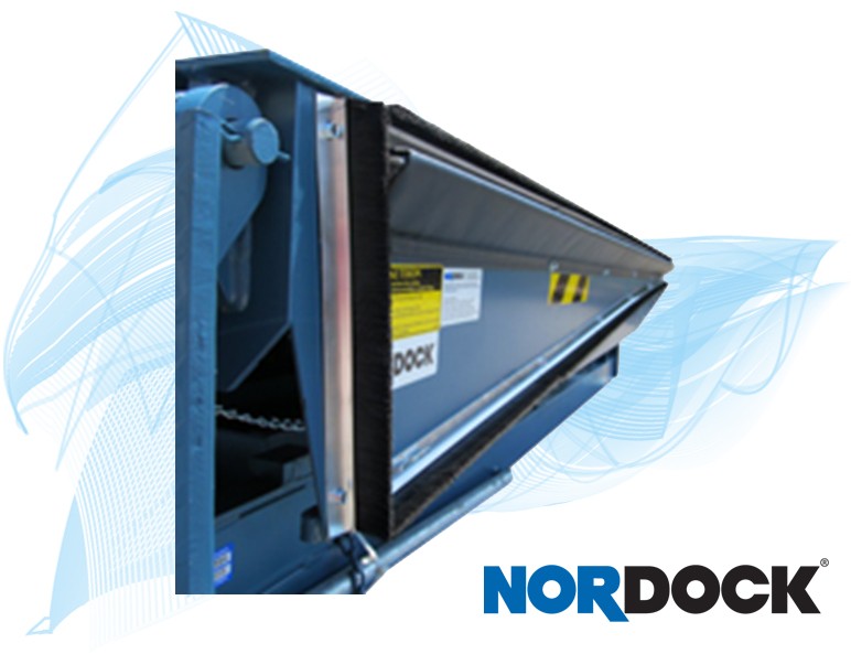 Close-up view of a loading dock leveler with safety markings and a brush seal, shown with the NORDOCK logo in the bottom right corner.
